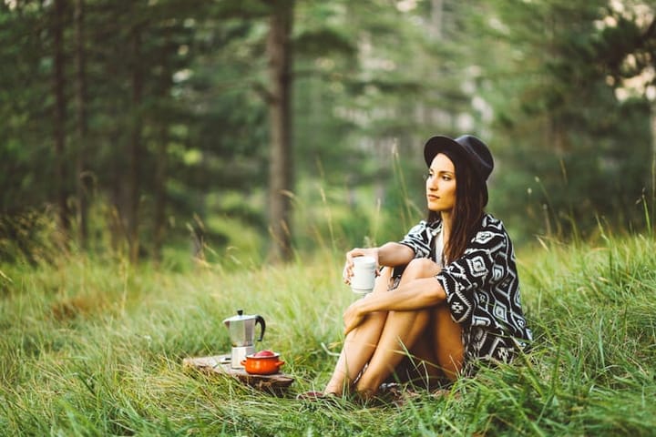 Young woman relaxing in the forest