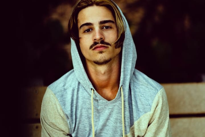 young man hoodie mustache