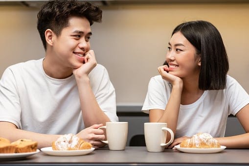 korean couple enjoying coffee