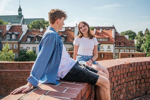 couple chatting on rooftop
