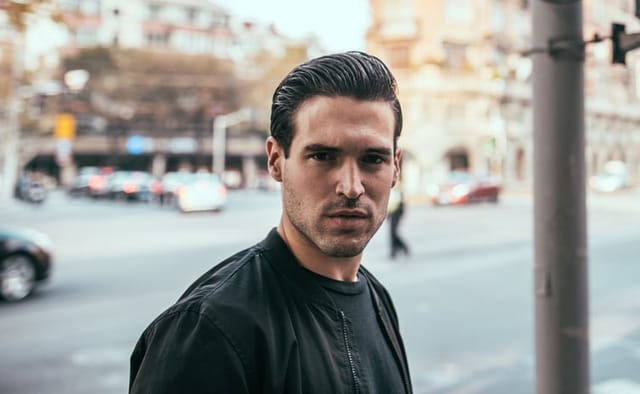 serious looking man on street