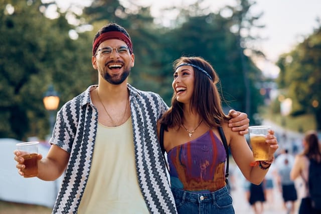 laughing couple walking at festival