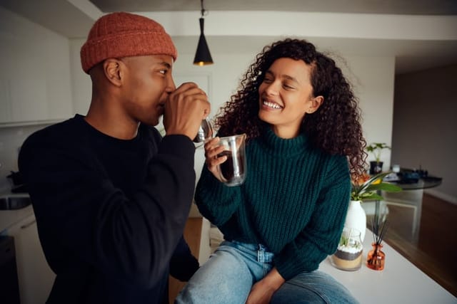 couple having coffee in kitchen