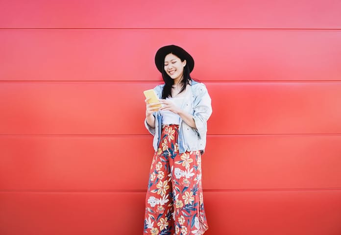 happy woman on phone outside