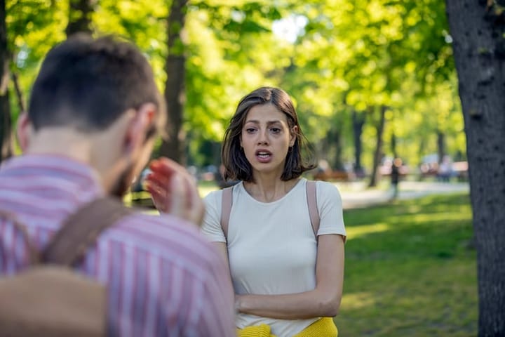 couple arguing in park