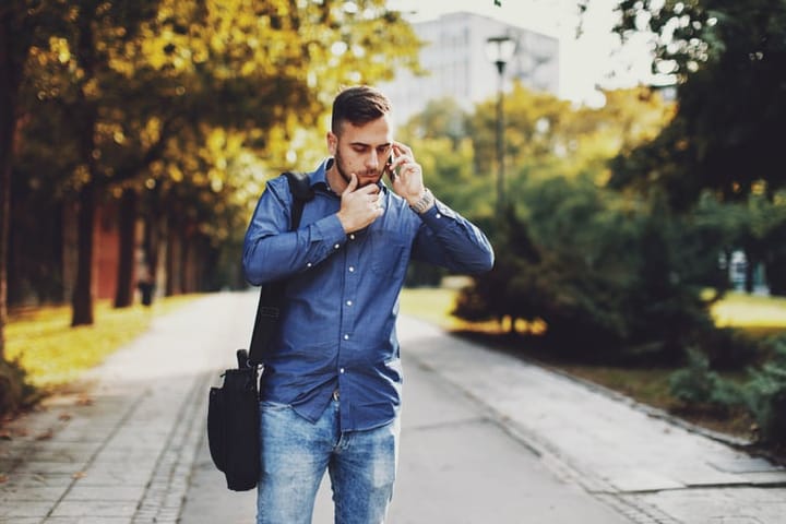 Handsome businessman talking on the phone outdoor