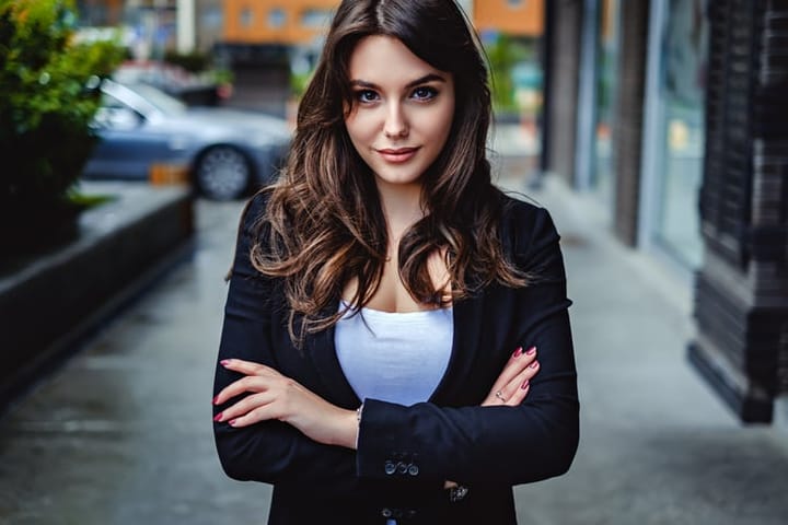 woman with crossed arms on street