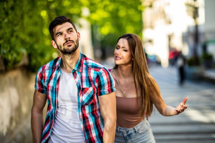 woman chasing upset boyfriend
