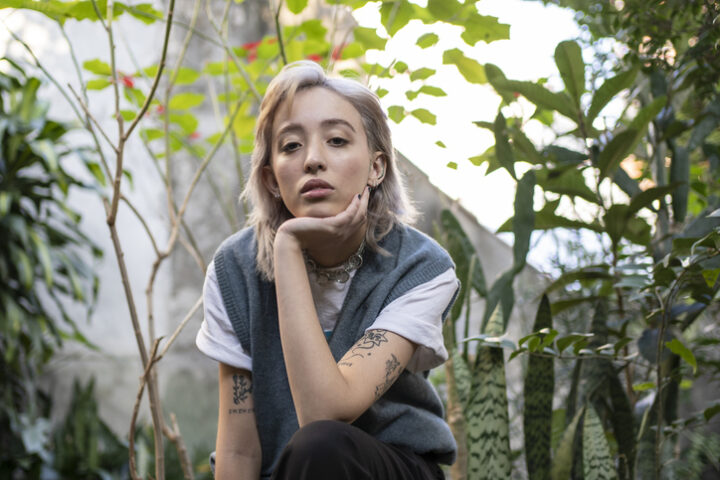 Nonbinary person in garden