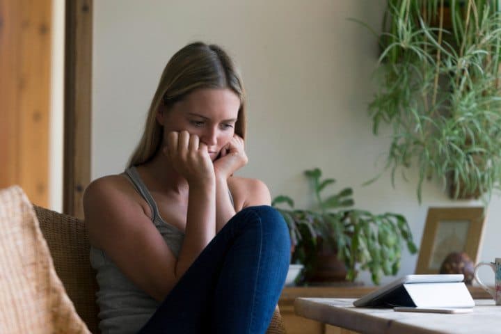 Woman looking stressed with technology