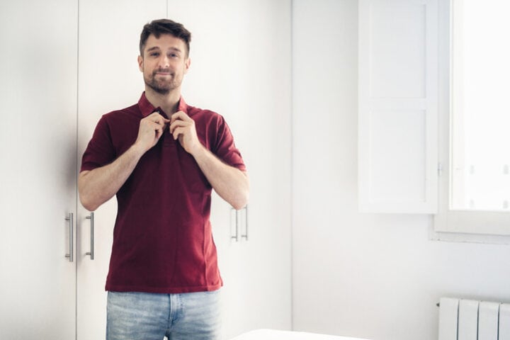man wearing jeans and polo